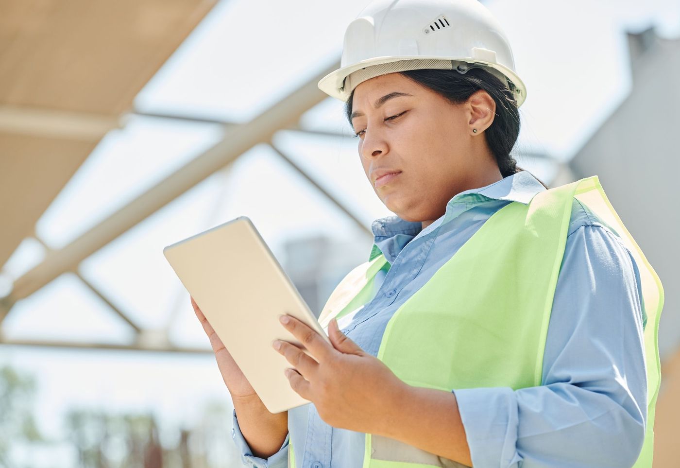 Engineer reviewing system information on a tablet